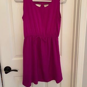 Fun flattering magenta dress. Cut out details on the back. Super cute!